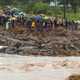 Schoolchildren are stranded across a collapsed bridge in Chimanimani, southeast of Harare, Zimbabwe, Monday, March 18, 2019.